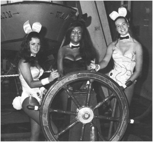 three playboy bunnies steering a ship