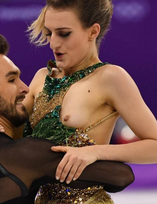 ice dancer revealing one breast after a skimpy beaded dress falls apart