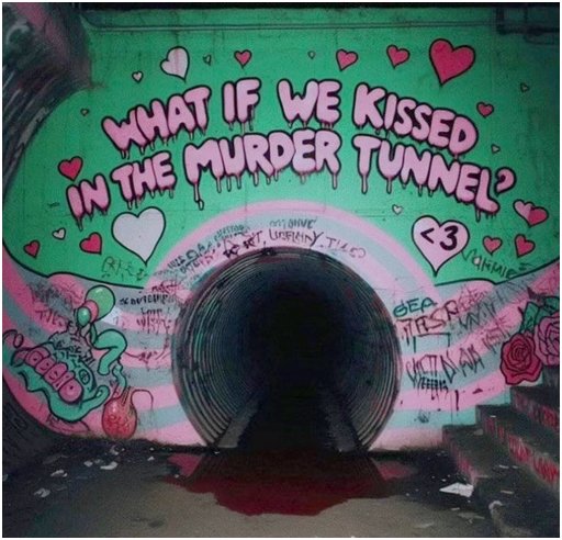 graffiti outside a dark culvert